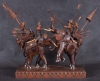 Raro grupo escultórico em teca e madeira representando "Cena de combate com Guerreiros sobre elefantes". Comp.46cm. Alt.48cm. India-1900.