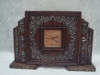 Relógio suíço para cima de móvel da "Aprosa", caixa em jacarandá com adornos em prata de lei provavelmente portuguesa. Medida: 22 X 33.