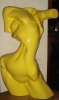ILDEBRANDO LIMA - "Torso feminino", escultura em resina na cor amarela. Alt. 65cm. Assinado.