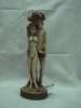 Raro grupo esculpido em marfim policromado Indo-Português representando "Adão, Eva e a Serpente". Base em madeira revestida em tecido. Alt. 23cm. Gôa - sec. XVII/XVIII.