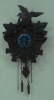 Relógio cuco miniatura em metal patinado. Mostrador esmaltado. Europa, 1900.