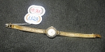 Relógio feminino suíço de pulso da marca "Classic". Caixa e pulseira em ouro 18k contrastado, ouro branco e 10 diamantes. Peso: 16,1g. Mecanismo a corda. Funcionando.