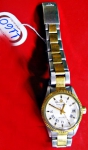 BAUME & MERCIER - Relógio feminino suiço de pulso com calendário da marca Baume & Mercier. Caixa e pulseira originais em aço e ouro.  Mecanismo automático. Funcionando.