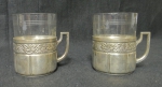Par de mugs alemães art nouveau espessurados a prata da marca "WMF", circa 1900. Acompanham recipientes originais em vidro lavrado.