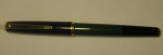 Caneta tinteiro da marca "Pelikan". Caixa em baquelite negro e verde.