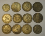 Doze moedas brasileiras em prata, sendo 11 de 2000 réis, 1 de 1000 réis (Império). Peso: 220g.