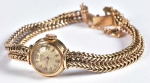 Relógio feminino suíço de pulso da marca "Renna". caixa e pulseira em ouro 18k-750mls contrastado. Peso: 18,7g. Funcionando.