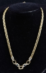 Gargantilha italiana em ouro 18k - 750mls contrastada, ornamentada com 2 safiras cabochon no centro. Comp.: 43,5cm. Peso: 22,1g.