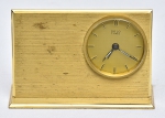 Relógio francês de cabeceira com despertador da marca "Solo". Estrutura e base retangulares em bronze dourado. Alt.: 8cm. Comp.: 12cm. Movimento a corda. Funcionando.
