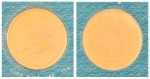 Moeda em ouro 24k emitida pelo "Banco do Brasil" com o símbolo do "Pau Brasil". Peso: 10g. Invólucro lacrado. (Virgem).