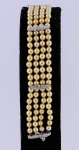 Antiga pulseira de 4 fios com 96 pérolas de aproximadamente 4mm. Fecho e separadores em ouro branco com 4 diamantes. Comp.: 17cm. (Falta 1 diamante).