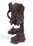 Grupo escultórico em madeira escura representando "Cabeças de Animais Selvagens". Alt.: 37cm. Europa-Séc.XX.