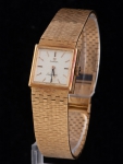 OMEGA. Relógio feminino suíço de pulso da marca "Omega", modelo "Ladymatic". Caixa e pulseira em ouro 18k-750mls contrastado. Mecanismo automático. Peso: 55,5g. Funcionando.