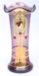 Antigo vaso alemão art nouveau em vidro moldado na cor ametista com decoração floral e busto de dama em reserva no centro. Borda de babado. Alt.: 24cm. (Em função da fragilidade, este lote só poderá ser enviado para fora do estado através de transportadora especializada).