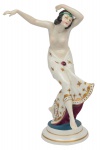 Figura art deco em porcelana alemã de "Thuringe", manufatura "Katzhutte", representando "Hindu Dancer". Alt.: 22cm. Marca no fundo. Reproduzido com foto no catálogo. (Em função da fragilidade, este lote só poderá ser enviado para fora do estado através de transportadora especializada).