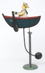 Antigo móbile em ferro esmaltado, representando "menino marinheiro com seu barquinho a remo". Alt.: 44cm.