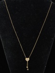 LIOR. Gargantilha em ouro 18k - 750mls contrastado com 3 pendentes conjugados no feitio de "Coração" decorados com 8 brilhantes. Peso: 3g. Marca da grife.