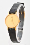 BAUME & MERCIER. Relógio feminino suíço de pulso da marca "Baume & Mercier", caixa em ouro 18k - 750mls contrastado. Pulseira original em couro. Mecanismo a corda. Funcionando.