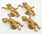Quatro puxadores italianos em bronze dourado, representando "Puttis". Fixador no feitio de roseta. Alt.: 14cm.