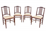 Quatro cadeiras tailandesas em madeira clara envernizada. Estrutura e espaldar torneados no feitio de junco. Assento forrado em courino bege. Tailândia - séc. XX.