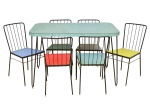 CONSTANTIN PAPAGIANNIS - DOXA MÓVEIS MODERNOS (DÉCADA DE 50). Mesa de jantar retangular e 6 cadeiras com estrutura em ferro torneado e esmaltado na cor negra. Tampo e barra da mesa revestidos em fórmica na cor verde. Assentos revestidos em fórmica nas cores verde, vermelha, azul, branca e amarela. Medida da mesa: alt. 78cm, tampo 120 X 75. Alt. das cadeiras: 80cm. Medida do assento: 40 X 40.